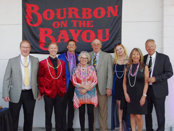 Guests pose at event.