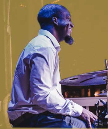 Musician Paul Gavin on drums.